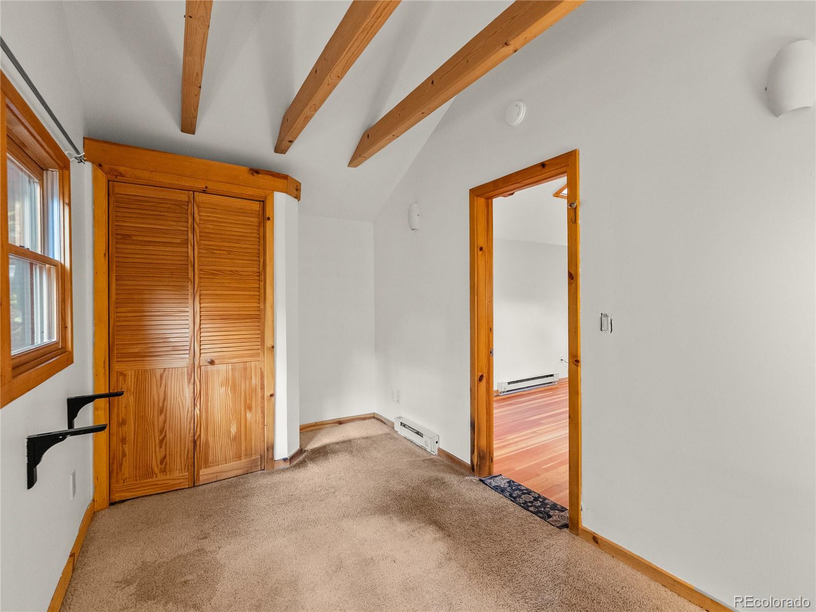 10853 Twin Spruce Road Golden, CO 80403 - Photo 24 of 32 an empty room with windows