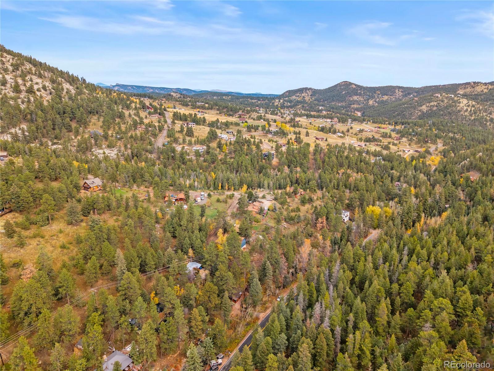 10853 Twin Spruce Road Golden, CO 80403 - Photo 29 of 32 a view of a city with mountains in the background
