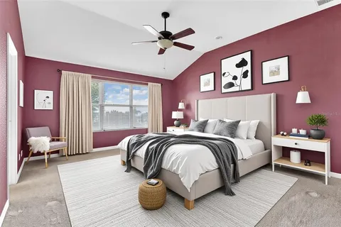 a bed room with a bed and a couch