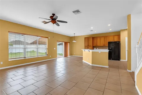 a view of a kitchen with microwave and a stove top oven