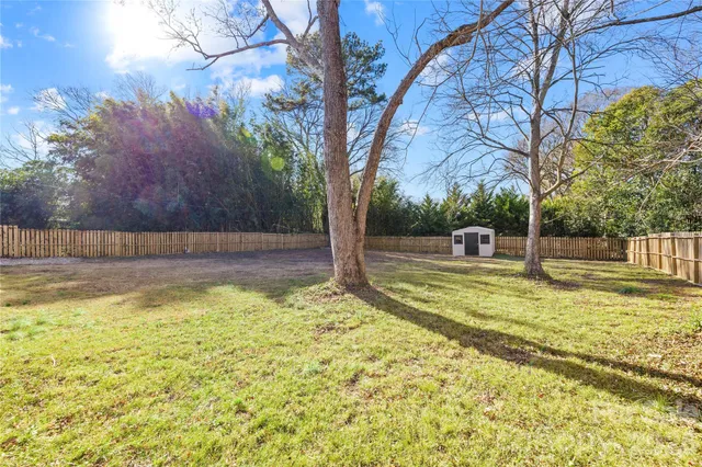 a view of a swimming pool with a yard