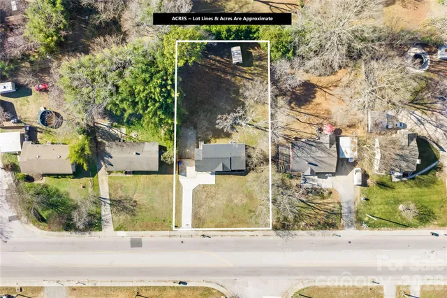 an aerial view of houses with yard