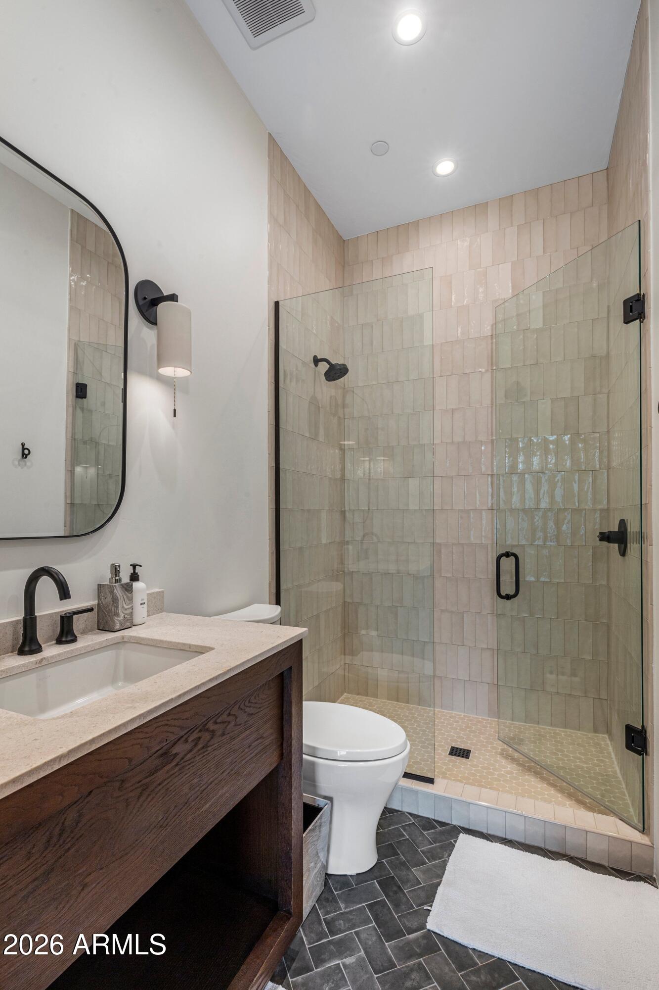 8307 East Gary Road Scottsdale, AZ 85260 - Photo 22 of 34 a bathroom with a sink a toilet and shower