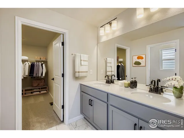 a en suite bathroom with a sink and mirror