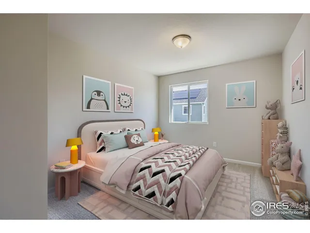 a bedroom with a bed a wall painting and a window