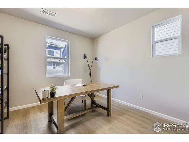 a view of a workspace with furniture