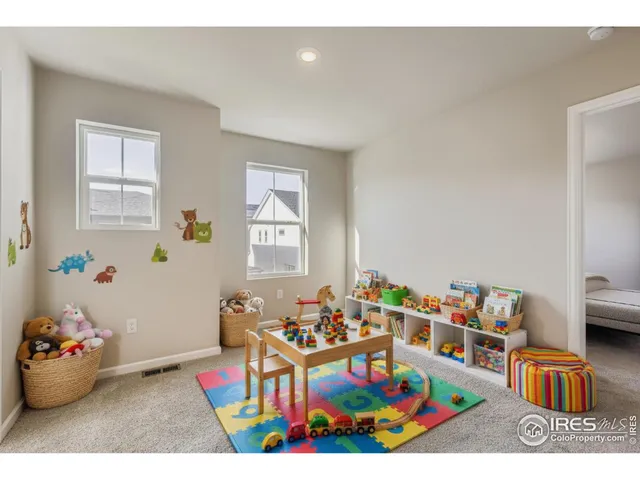 a living room with toys and a couch