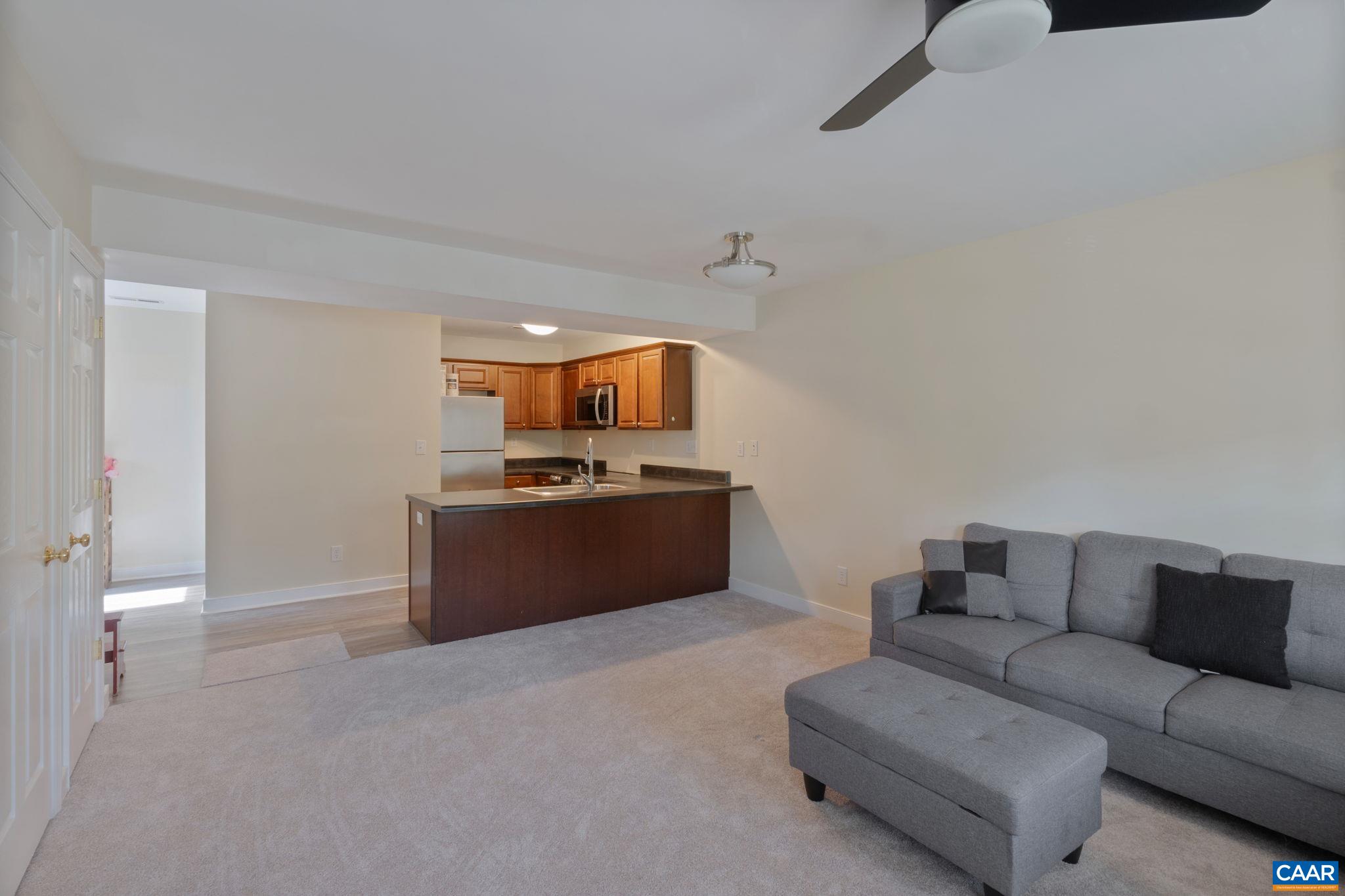 413 Valley Rd Extension Charlottesville, VA 22903 - Photo 3 of 18 a living room with furniture and kitchen view