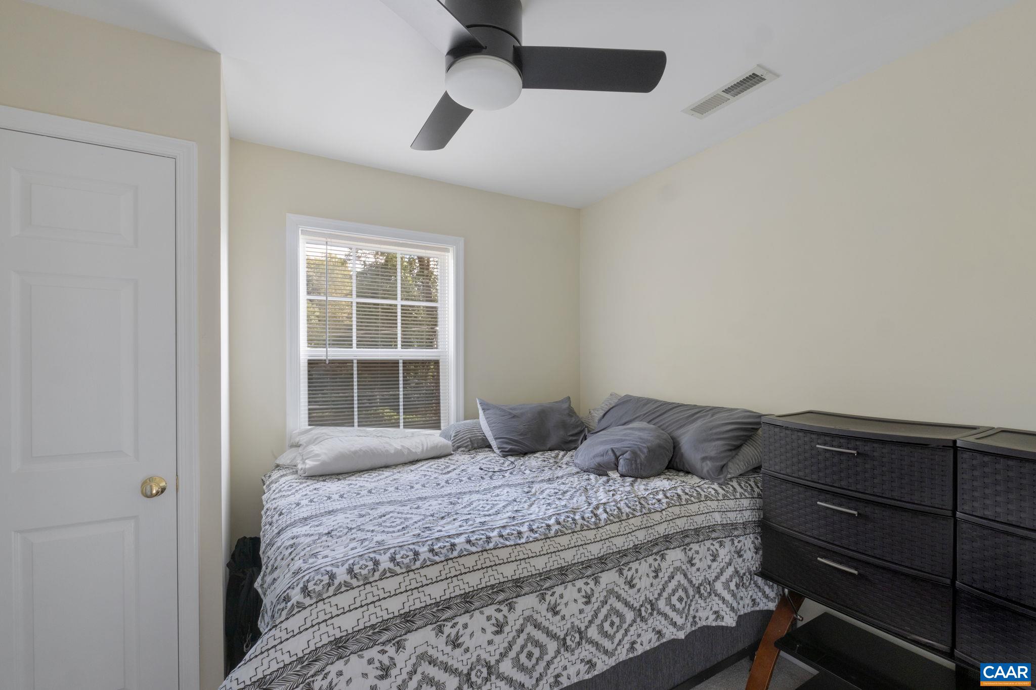 413 Valley Rd Extension Charlottesville, VA 22903 - Photo 7 of 18 a bedroom with a bed and a window
