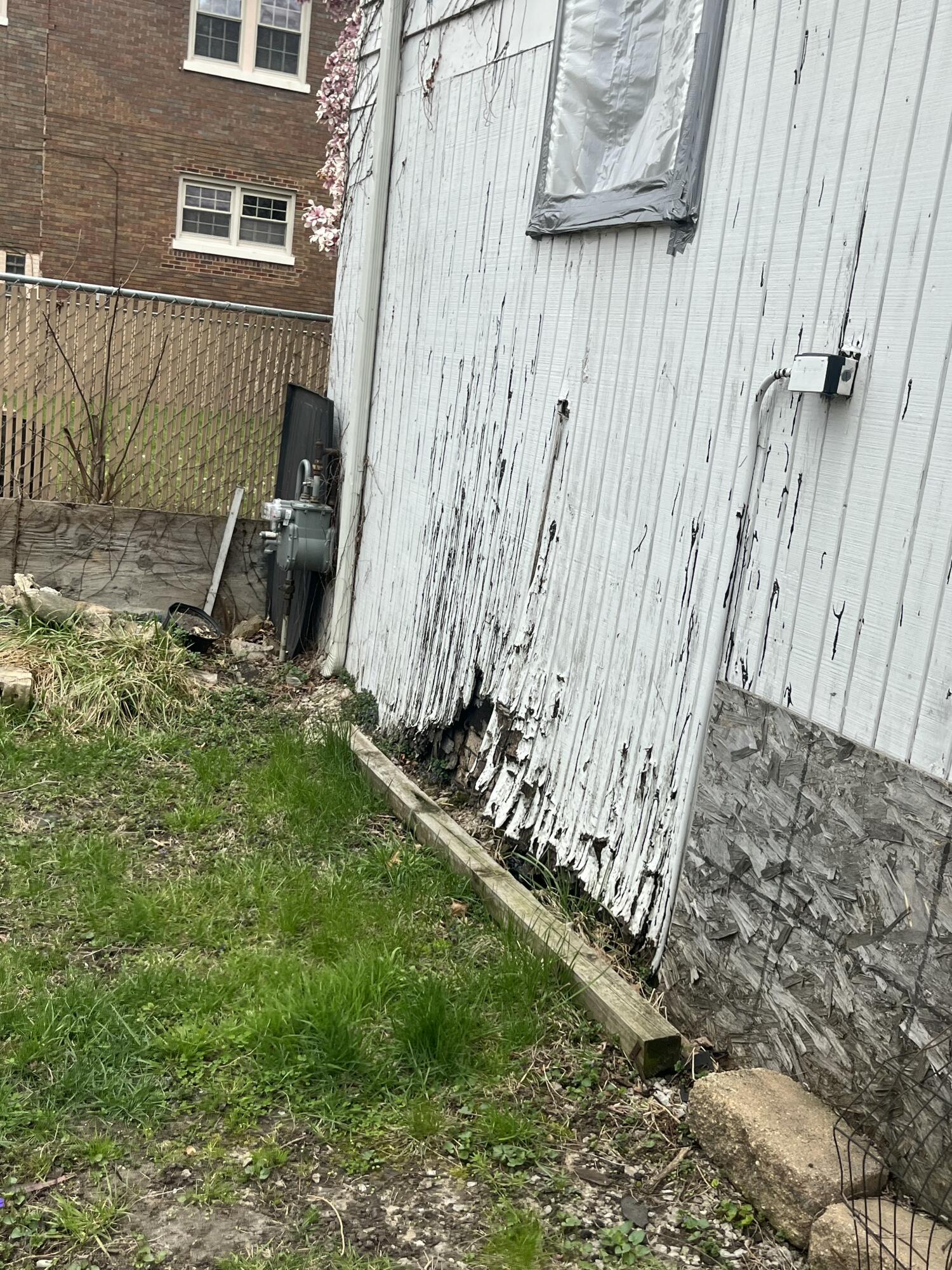3540 Pennsylvania Street Gary, IN 46409 - Photo 15 of 23 a view of a backyard with sitting area and wooden fence