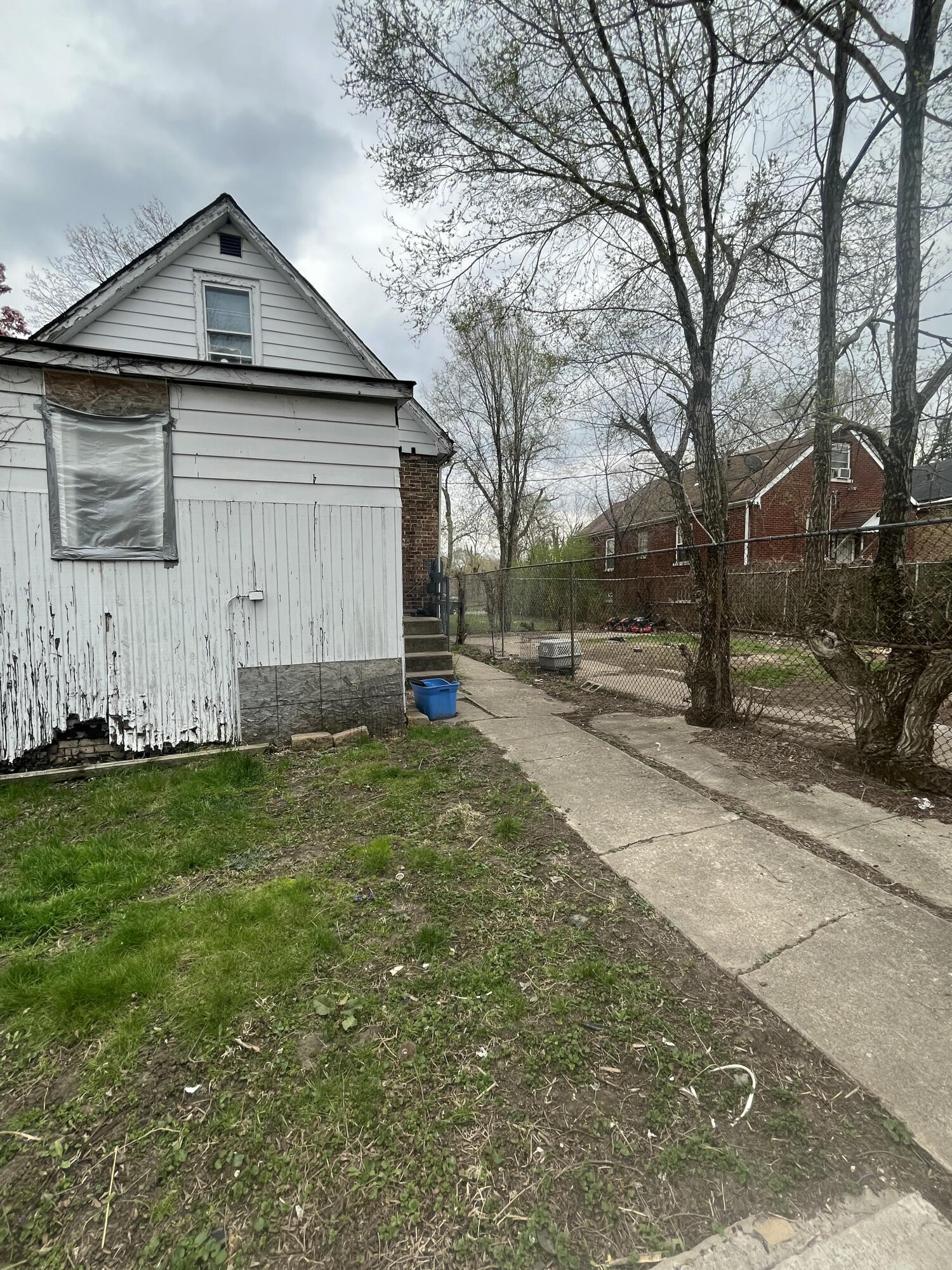 3540 Pennsylvania Street Gary, IN 46409 - Photo 17 of 23 a front view of a house with a yard