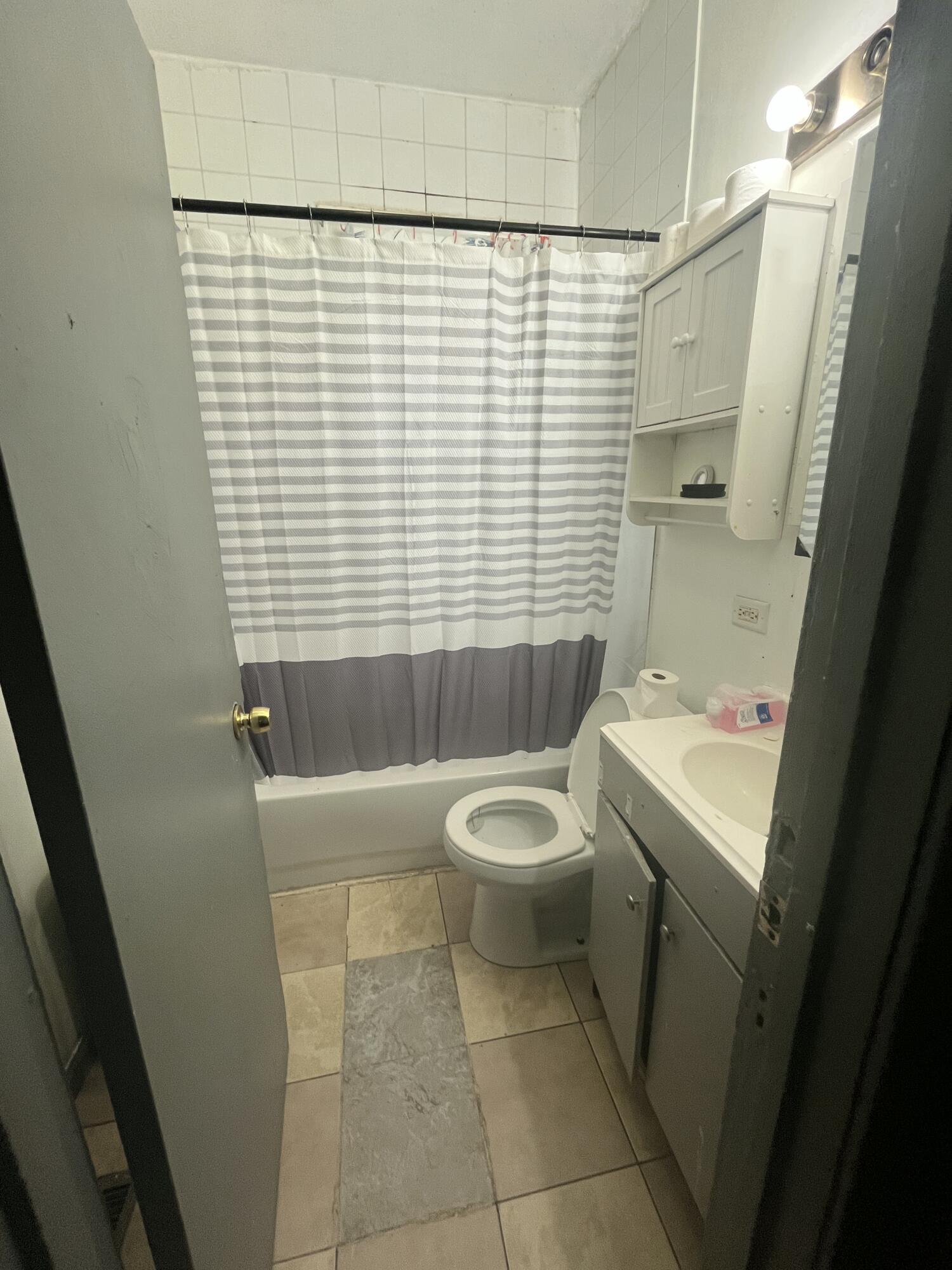 3540 Pennsylvania Street Gary, IN 46409 - Photo 7 of 23 a bathroom with a sink a toilet and shower