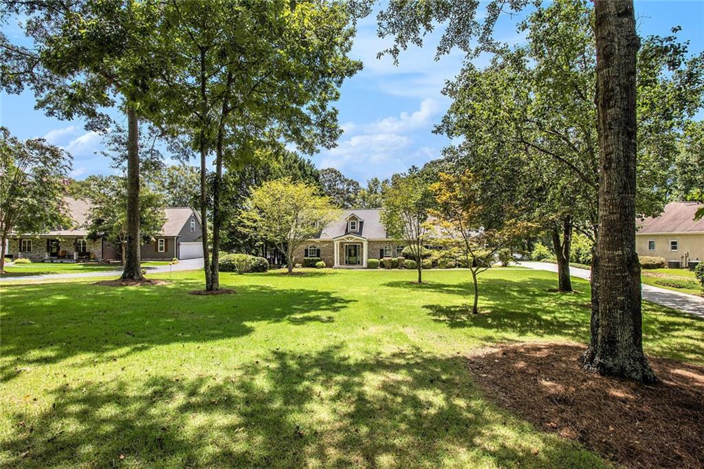 96 Pointe View Court Jackson, GA 30233 - Photo 30 of 36 a view of a backyard with green space