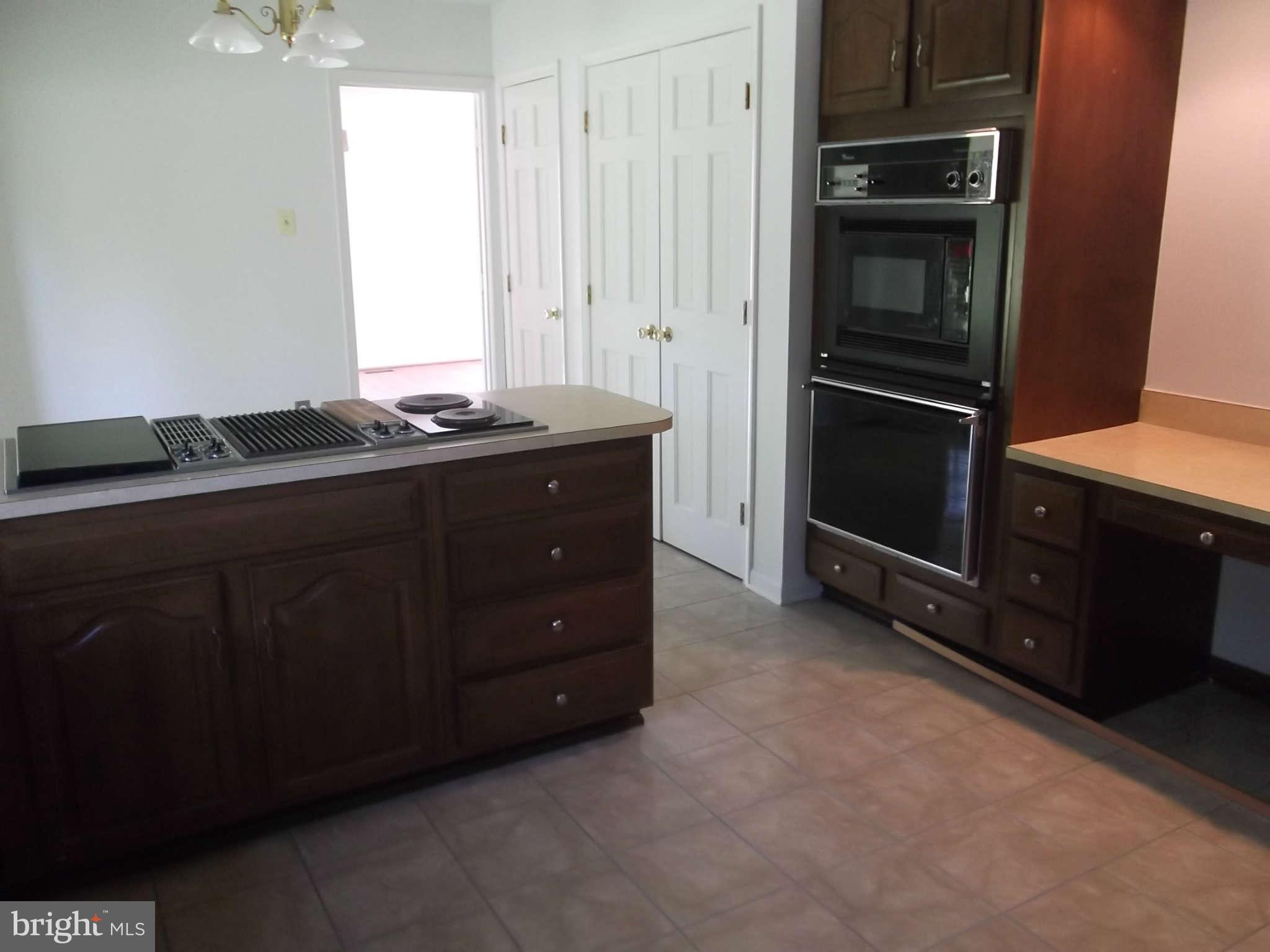 3317 Mt Carmel Road Upperco, MD 21155 - Photo 20 of 21 a kitchen with a refrigerator and cabinets