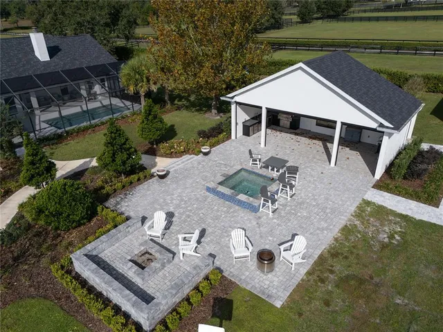 an aerial view of a house with pool