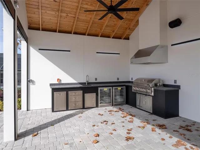 a kitchen with a stove and white cabinets