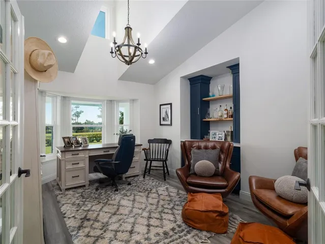 a work room with furniture and wooden floor