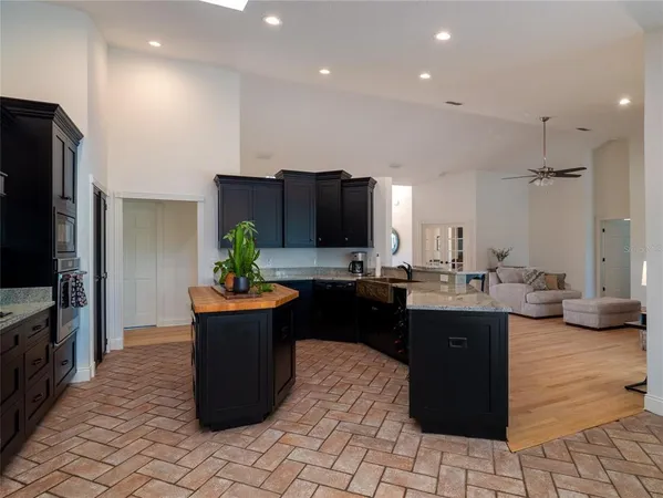 a kitchen with a sink and refrigerator