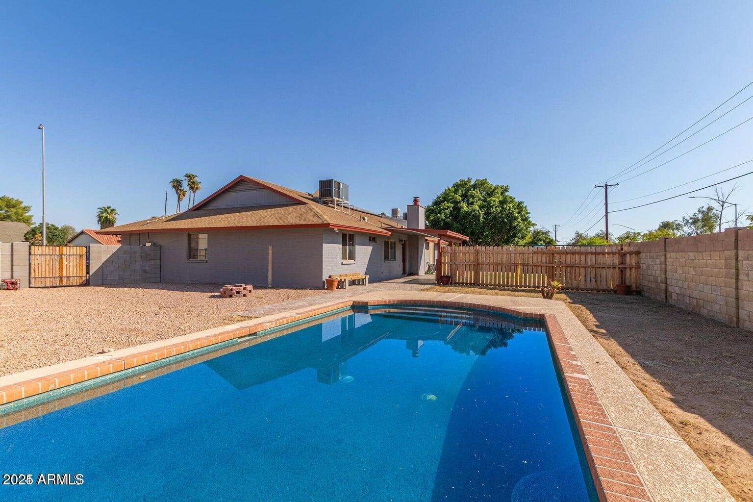 1316 North Spring Circle Mesa, AZ 85203 - Photo 14 of 14 a front view of a house with swimming pool