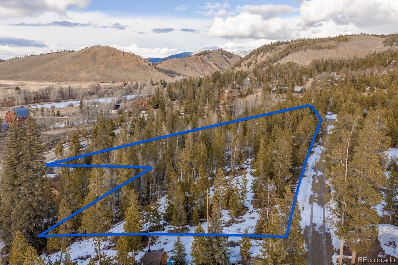 6202 County Road Granby, CO 80446 - Photo 9 of 19 a view of a city with mountains in the background