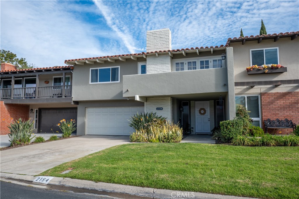 a house view with a garden space