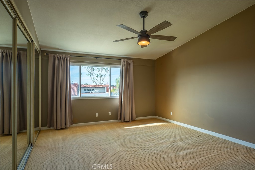 2154 Vista Entrada Newport Beach, CA 92660 - Photo 9 of 19 an empty room with windows and fan
