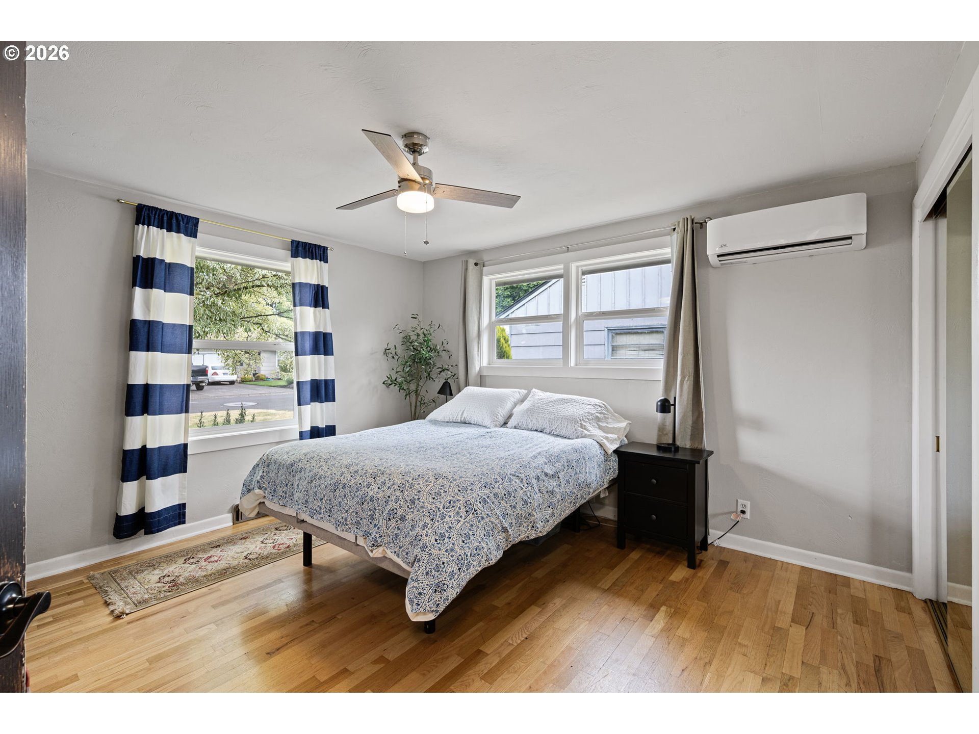 765 Louis Street Eugene, OR 97402 - Photo 21 of 45 a bedroom with a bed window and a dresser