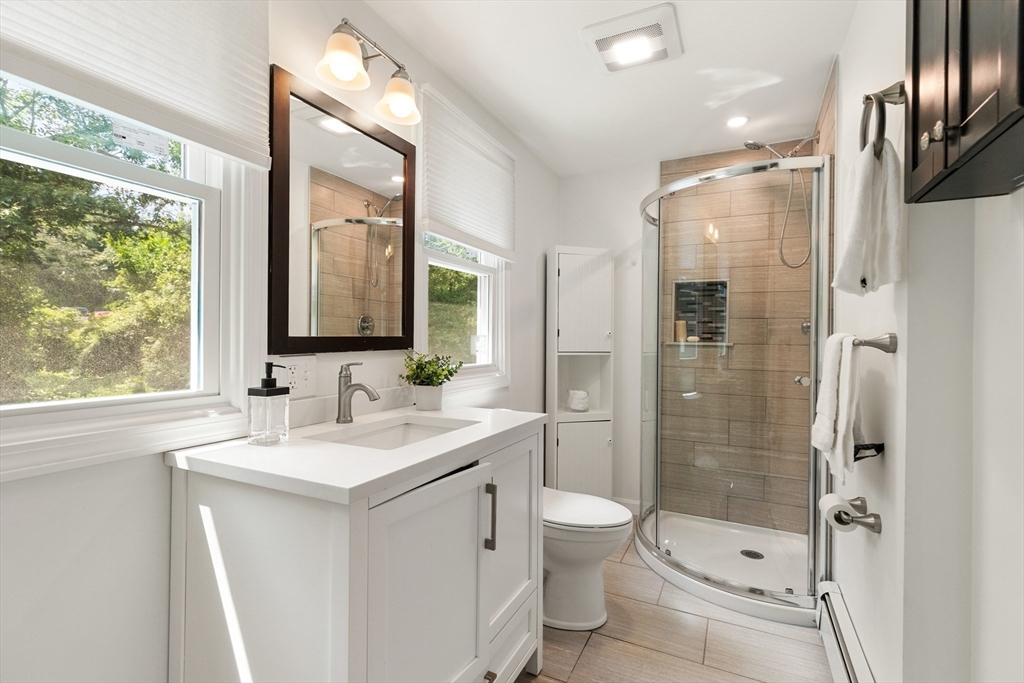 20 Oxbow Road Lexington, MA 02421 - Photo 17 of 30 a bathroom with a sink a toilet and shower