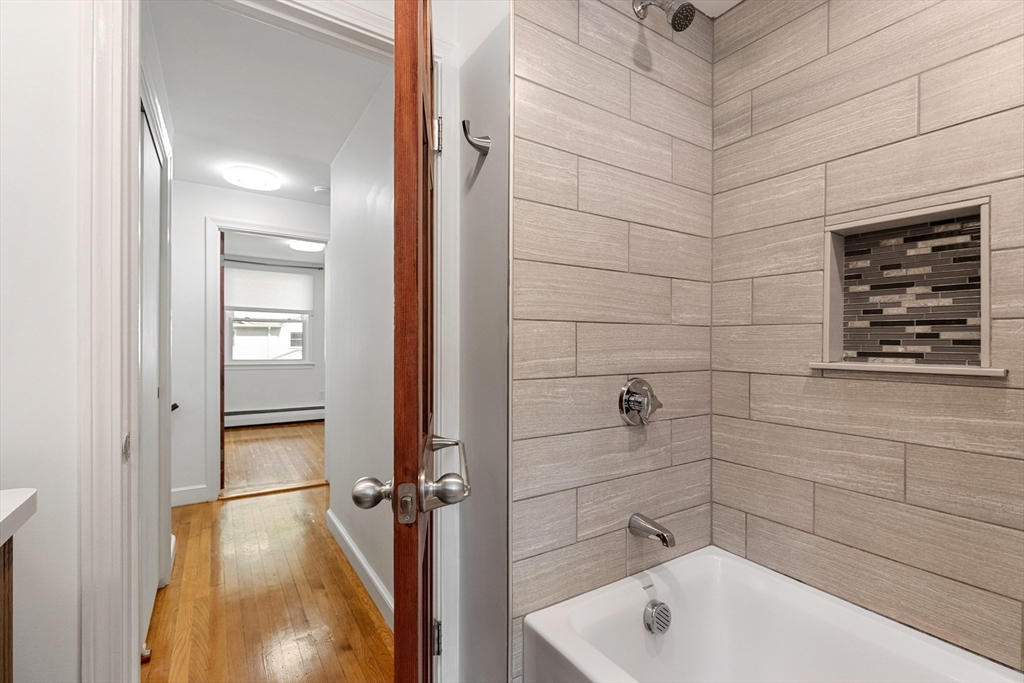 20 Oxbow Road Lexington, MA 02421 - Photo 21 of 30 a bathroom with a tub and shower