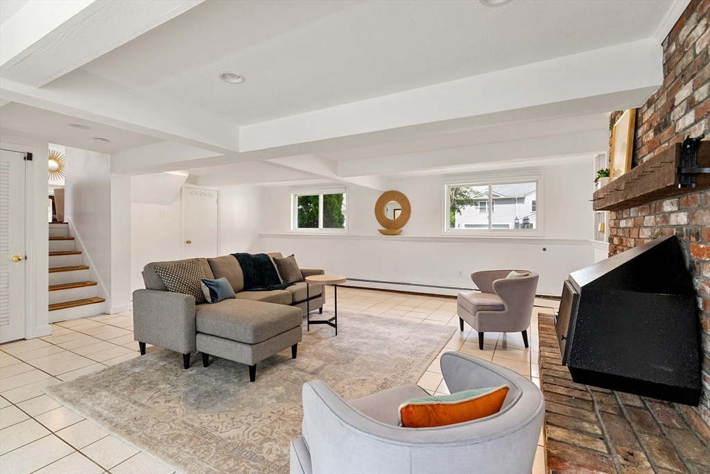 20 Oxbow Road Lexington, MA 02421 - Photo 23 of 30 a living room with furniture and a flat screen tv