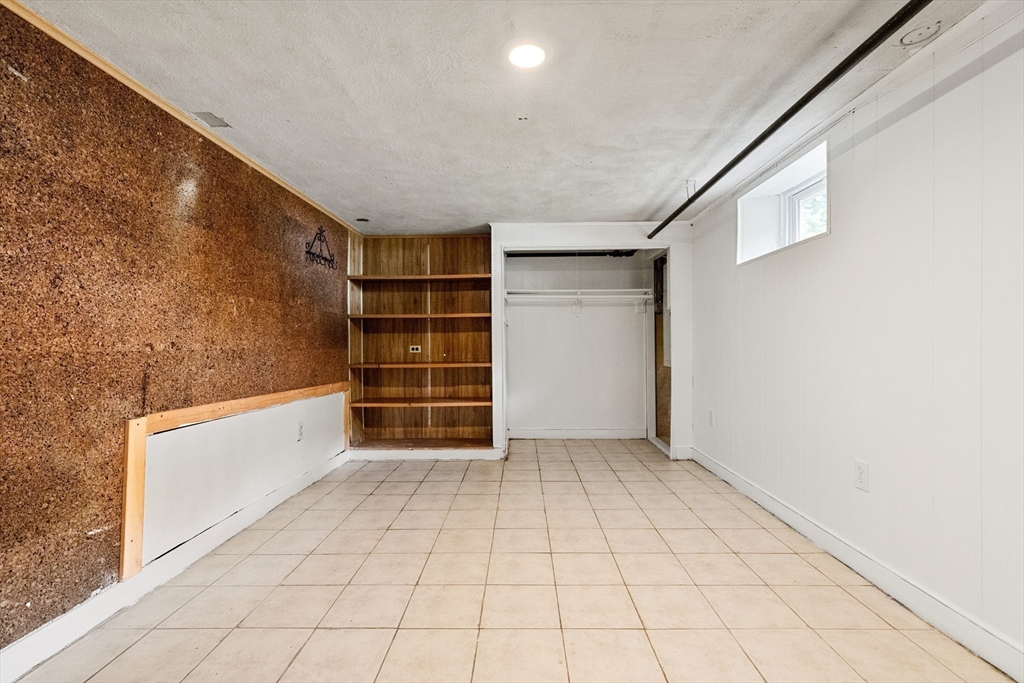 20 Oxbow Road Lexington, MA 02421 - Photo 28 of 30 a view of an empty room with cabinet and white walls