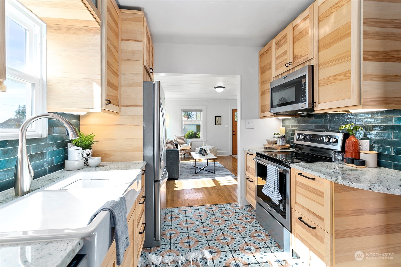 2404 I Street Bellingham, WA 98225 - Photo 11 of 38 a kitchen with stainless steel appliances granite countertop a stove a sink and a microwave