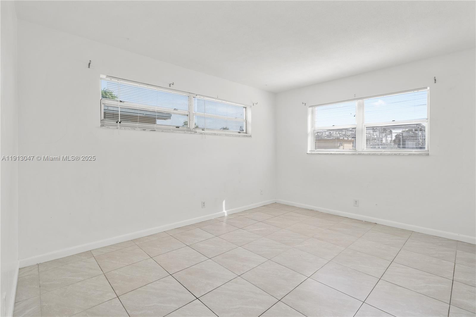856 Southwest 10th Street, Unit 1 Hallandale Beach, FL 33009 - Photo 12 of 15 an empty room with cabinet