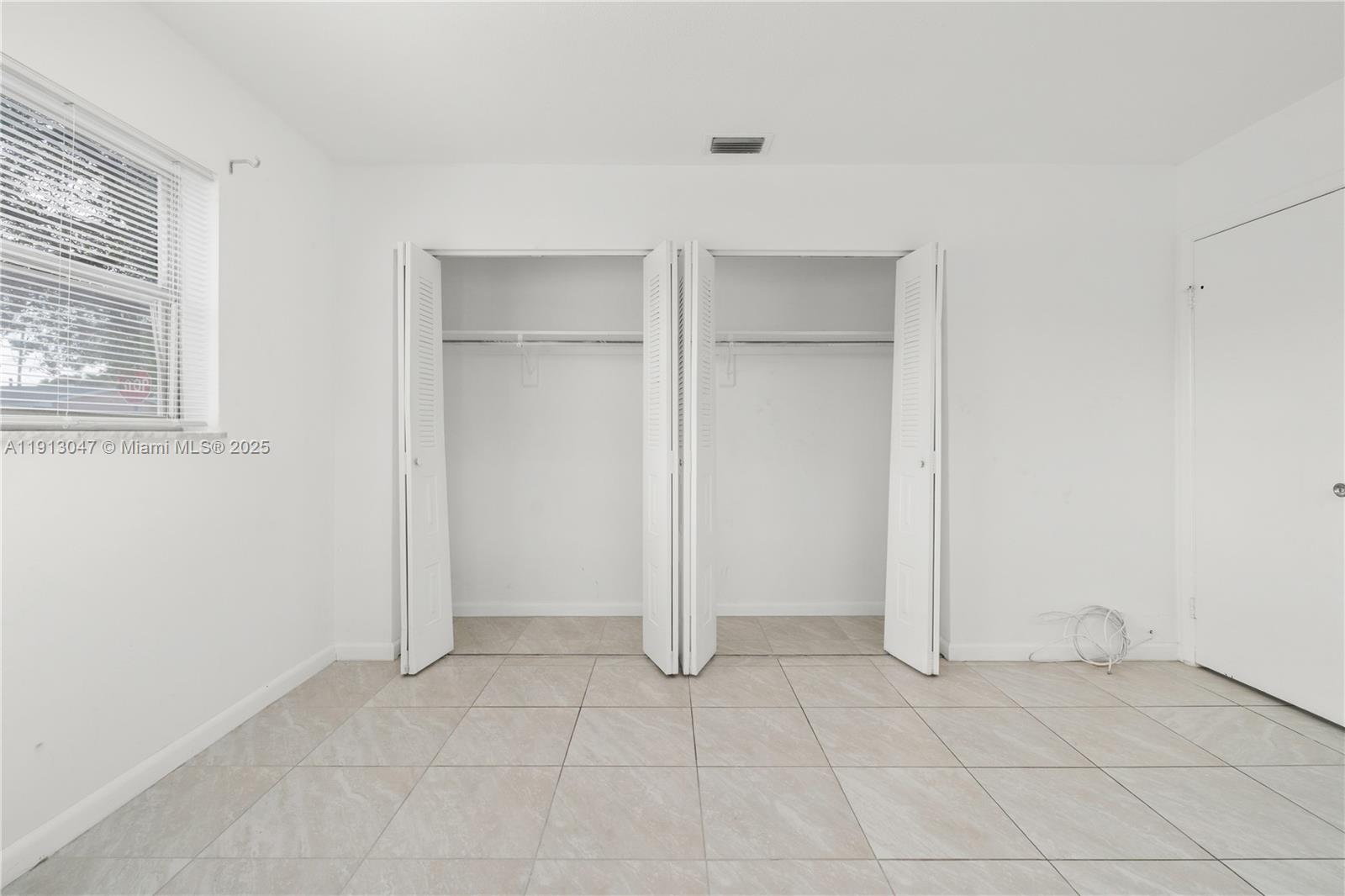 856 Southwest 10th Street, Unit 1 Hallandale Beach, FL 33009 - Photo 14 of 15 an empty room with a empty space