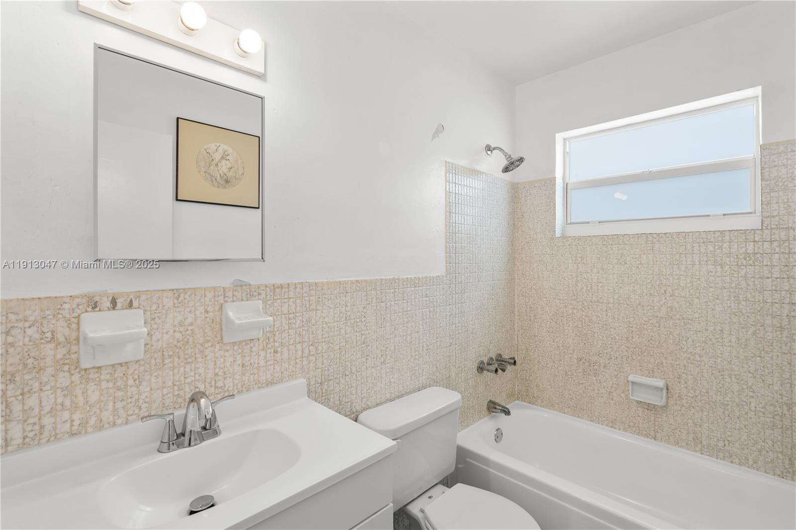 856 Southwest 10th Street, Unit 1 Hallandale Beach, FL 33009 - Photo 15 of 15 a bathroom with a sink a toilet and shower