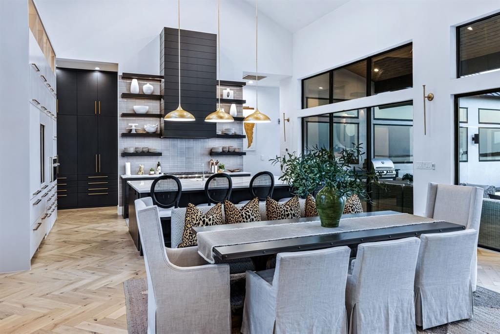 1129 Beacon Shr Road Kemp, TX 75143 - Photo 10 of 40 a kitchen with stainless steel appliances kitchen island granite countertop a table and chairs in it