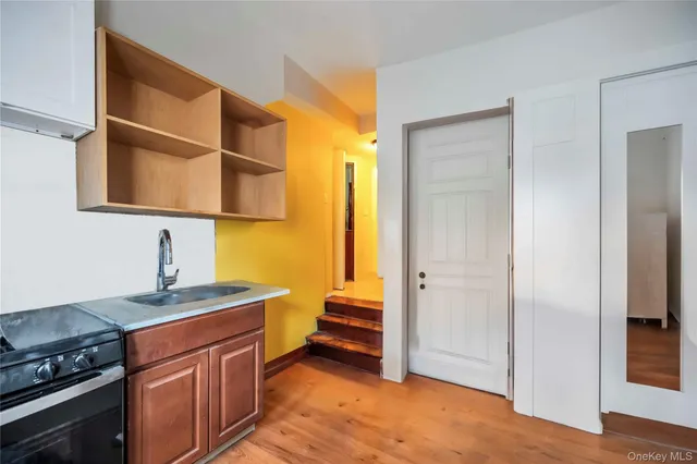 a kitchen with stainless steel appliances a sink and a stove