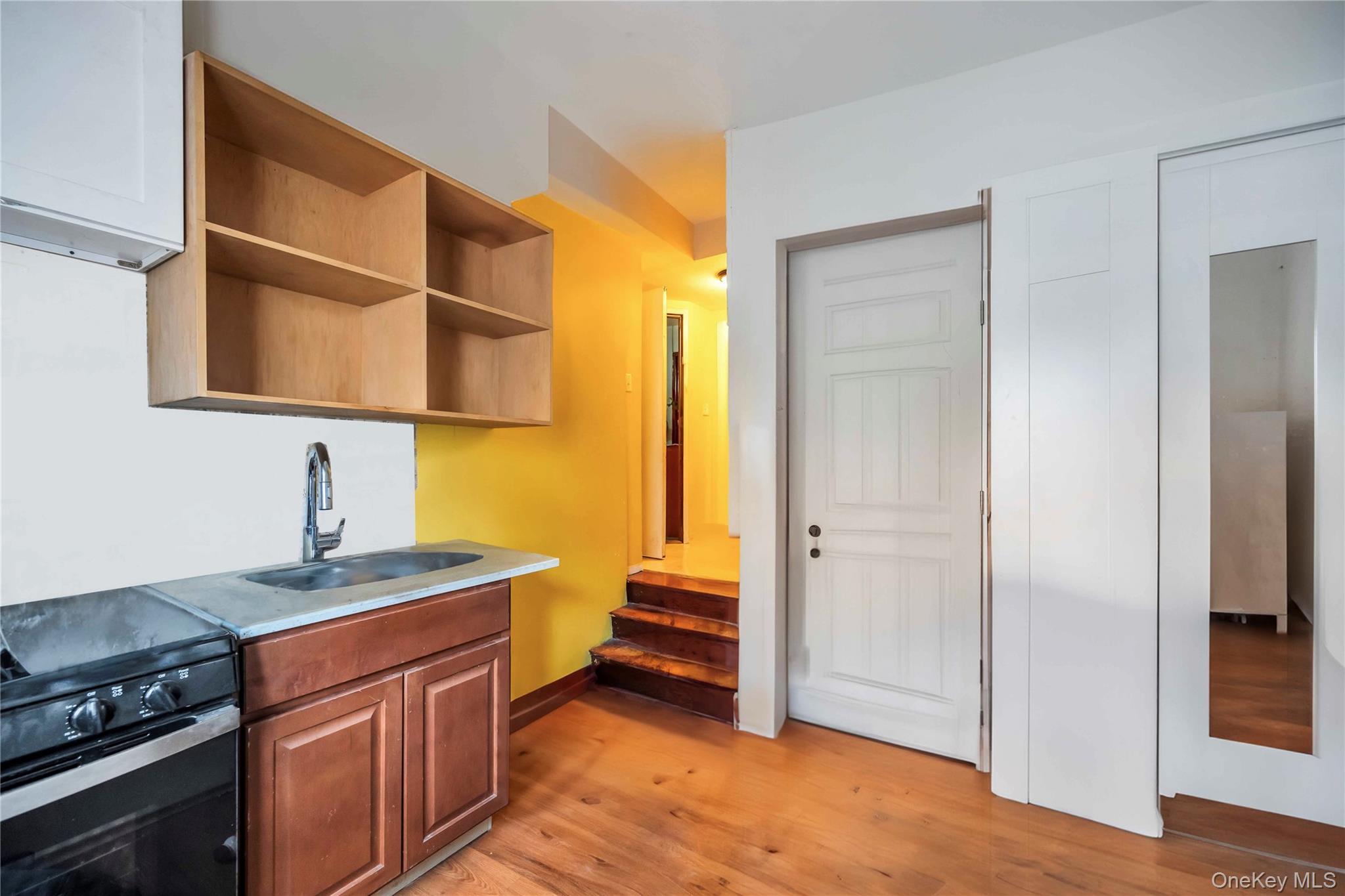 55-14 98th Street Queens, NY 11368 - Photo 13 of 49 a kitchen with stainless steel appliances granite countertop a refrigerator and a sink