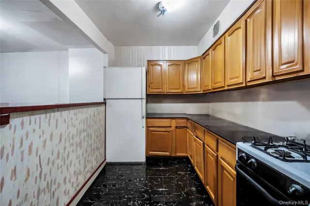 a kitchen with a stove and a microwave