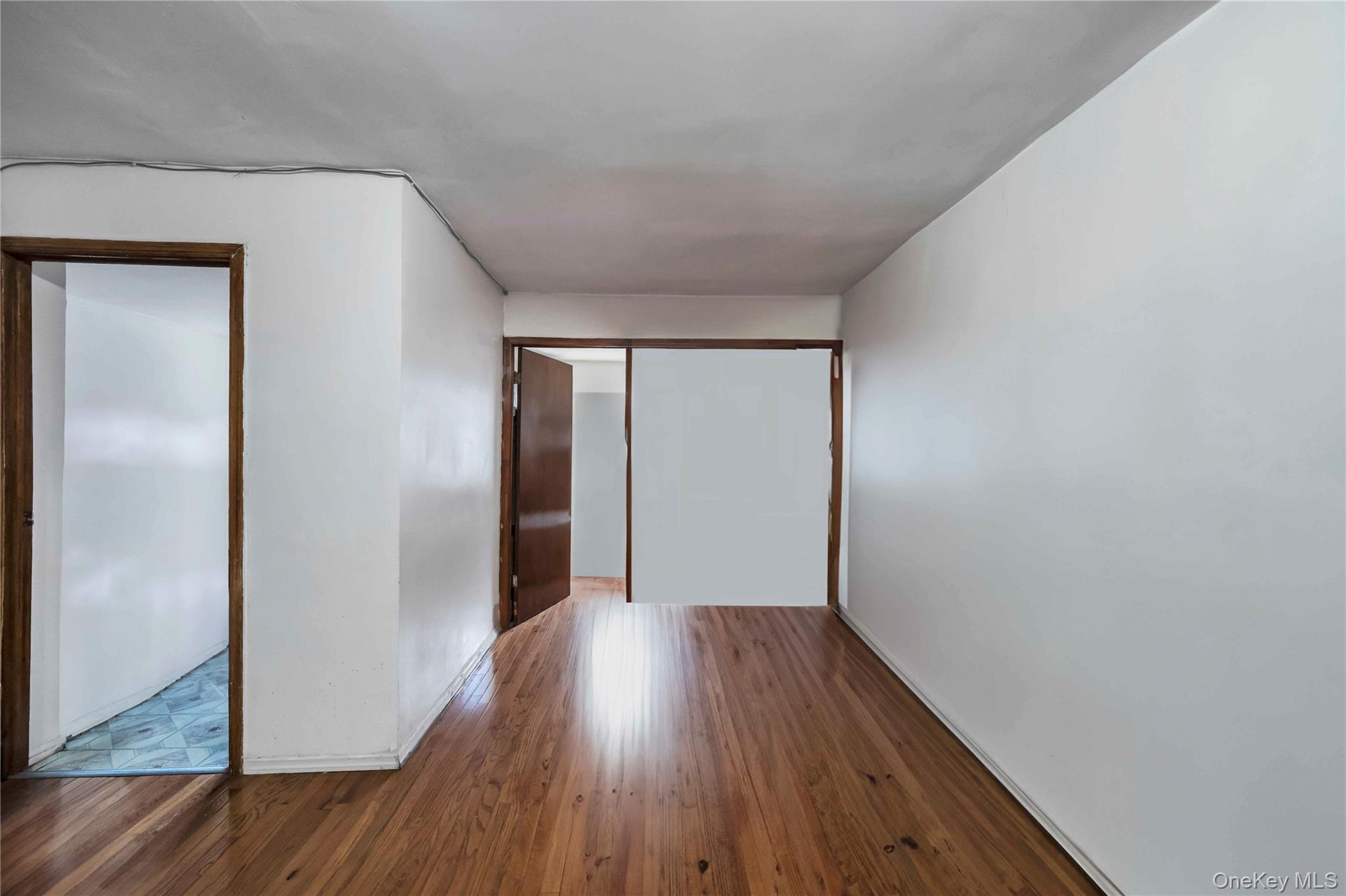 55-14 98th Street Queens, NY 11368 - Photo 22 of 49 a view of hallway with wooden floor