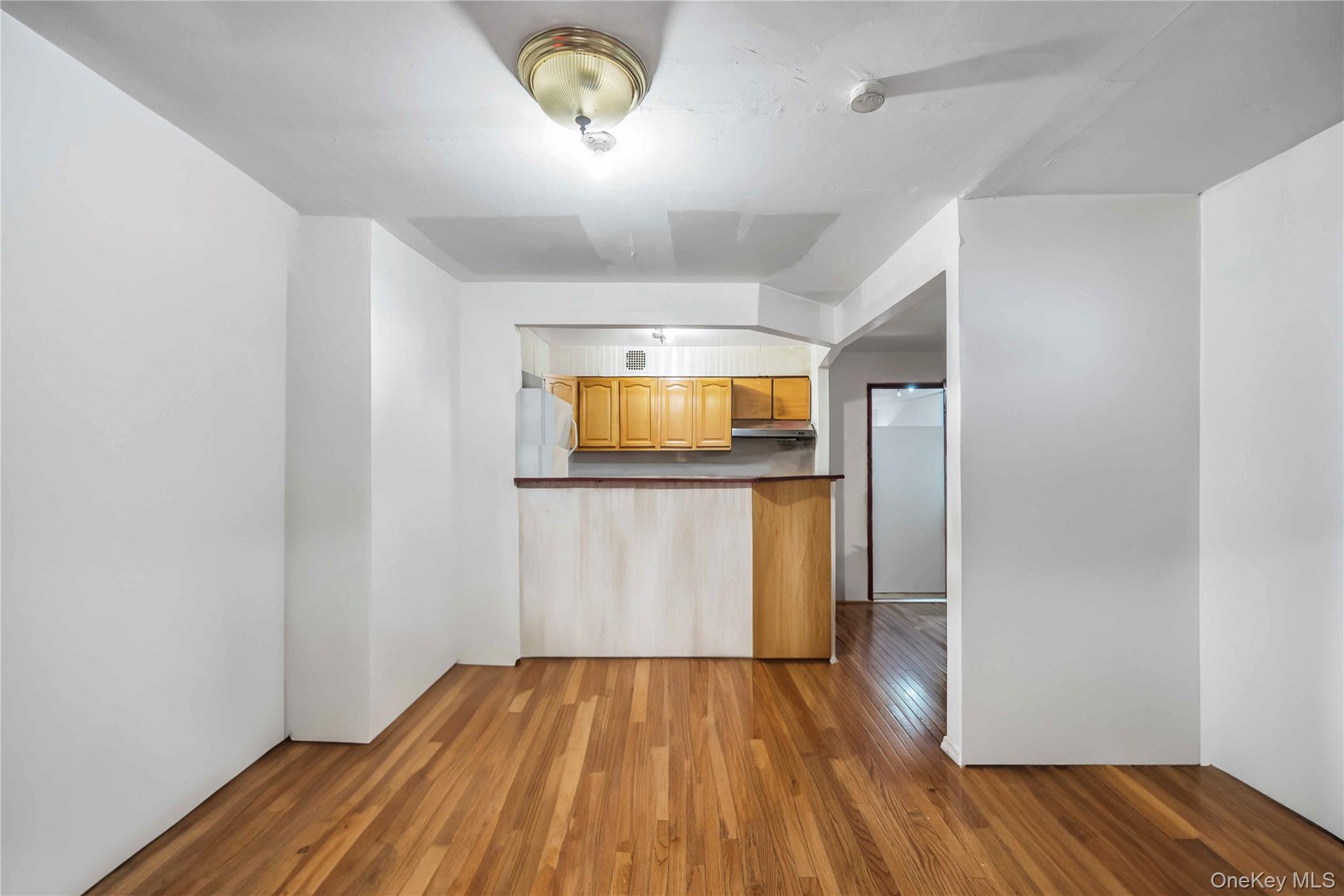 55-14 98th Street Queens, NY 11368 - Photo 24 of 49 a view of empty room with wooden floor