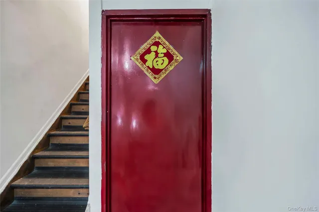 a view of an empty room with stairs