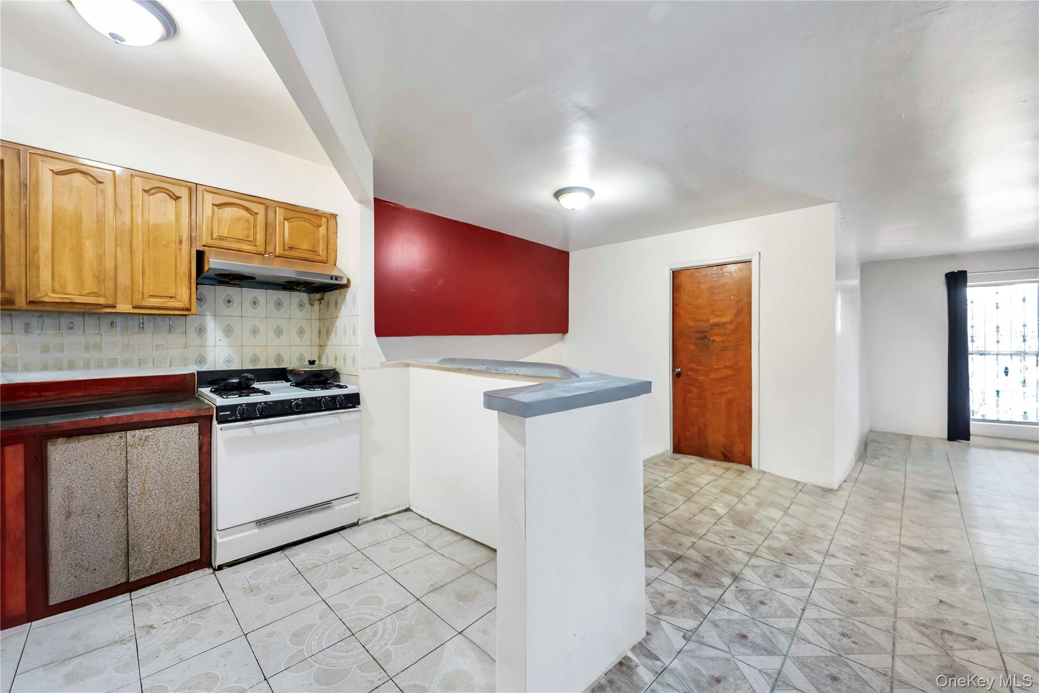 55-14 98th Street Queens, NY 11368 - Photo 29 of 49 a kitchen with stainless steel appliances granite countertop a stove a sink and a refrigerator