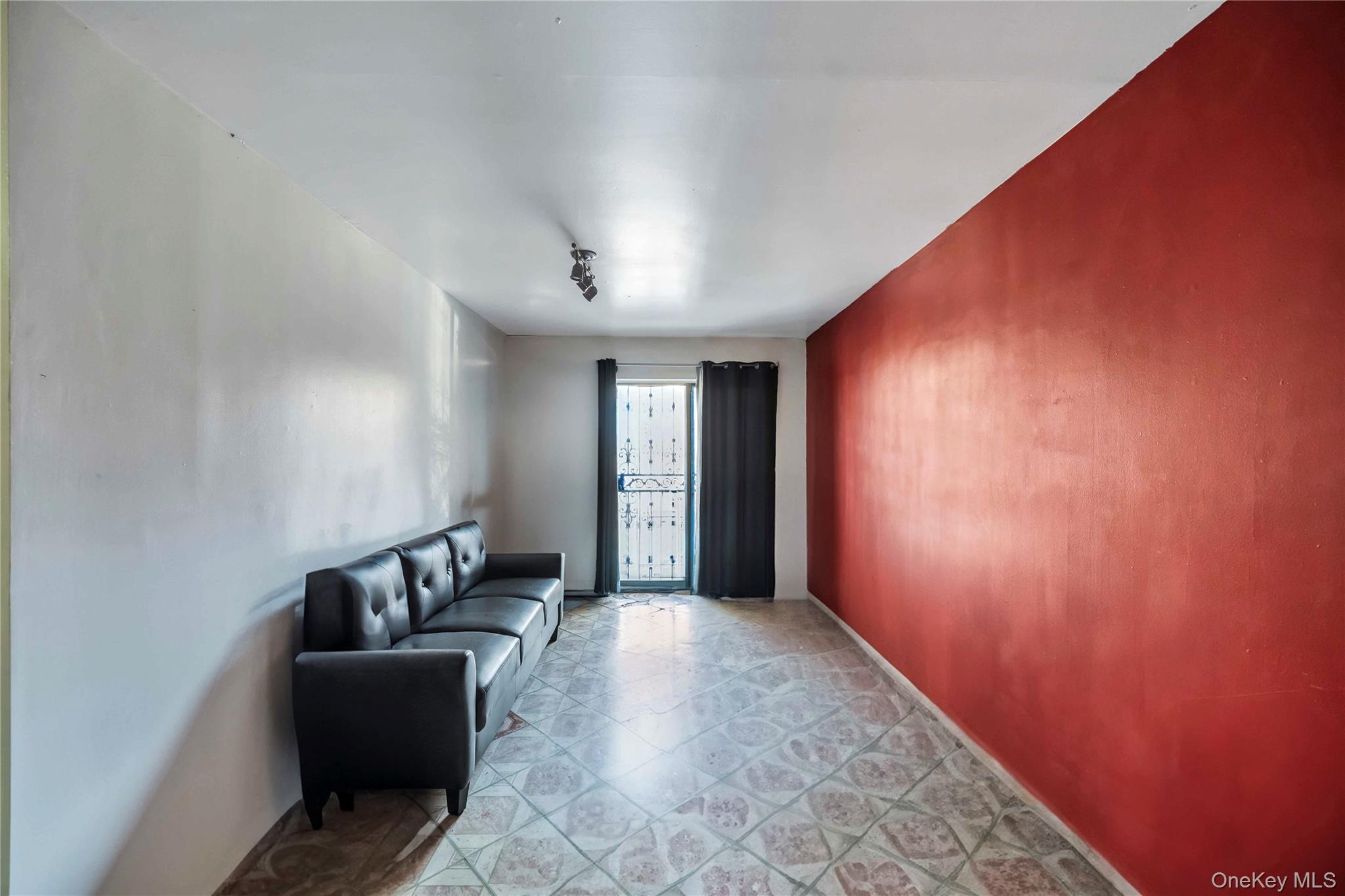 55-14 98th Street Queens, NY 11368 - Photo 32 of 49 a living room with furniture and a window