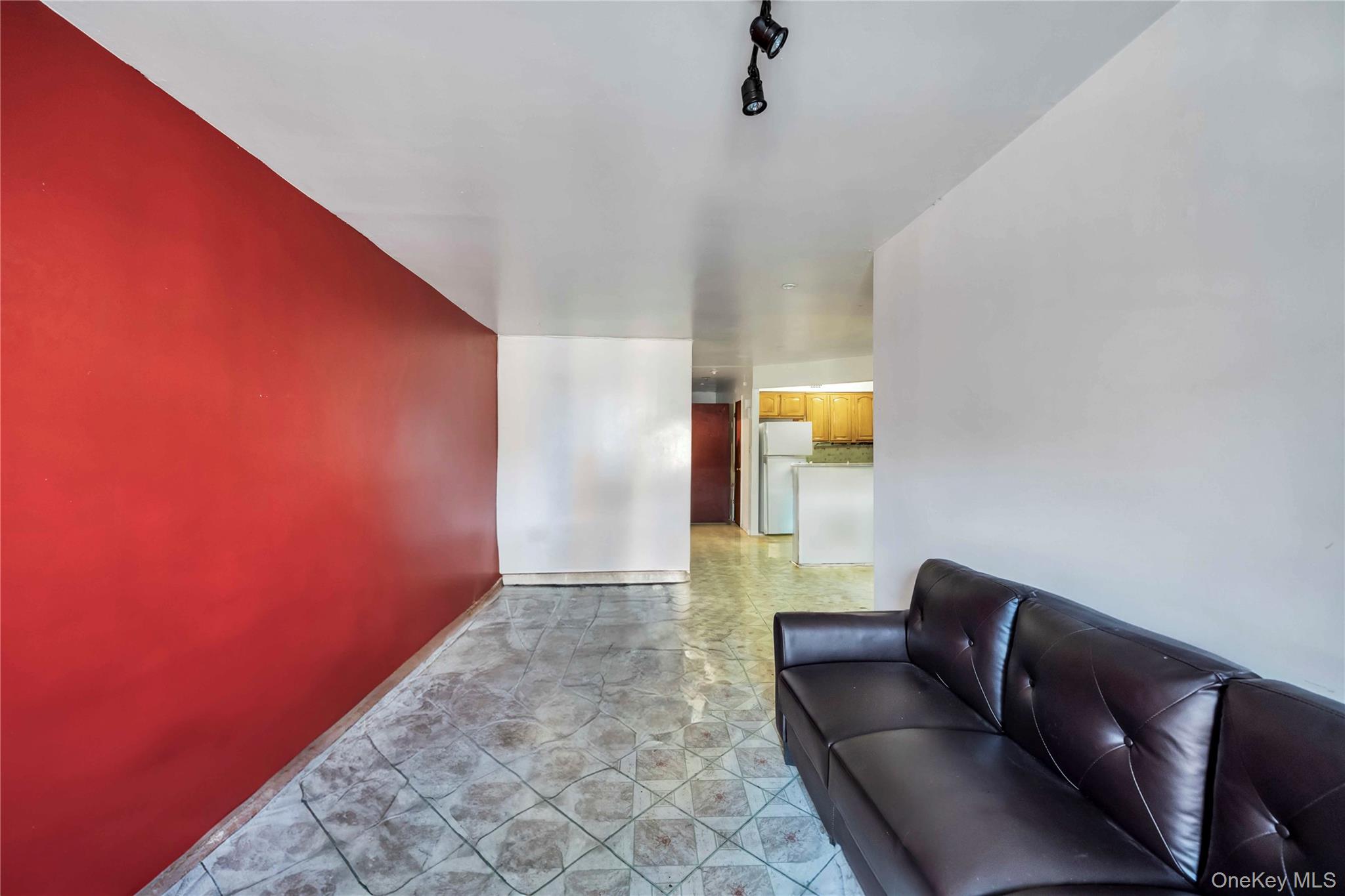 55-14 98th Street Queens, NY 11368 - Photo 33 of 49 a living room with furniture and a rug