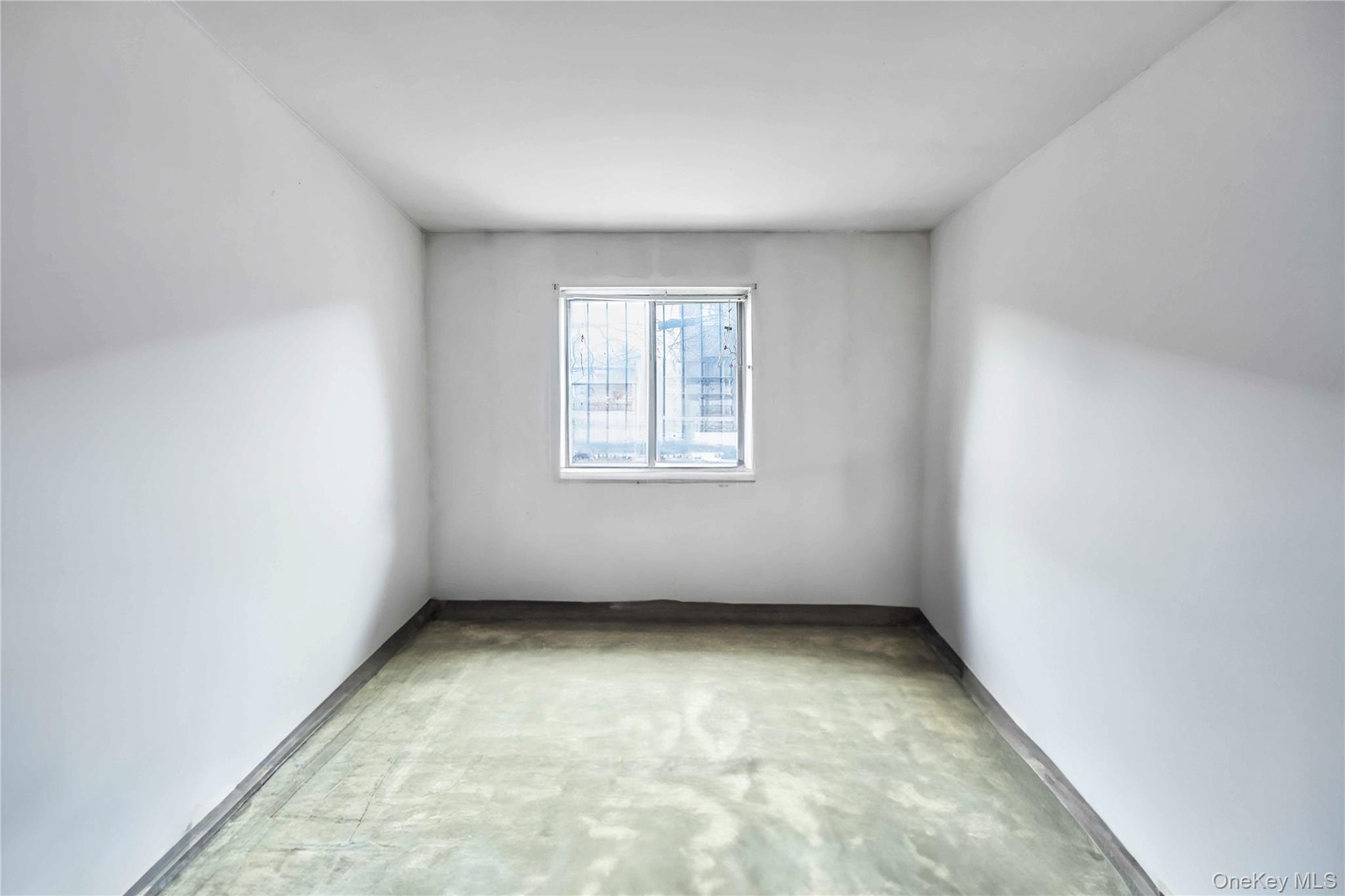 55-14 98th Street Queens, NY 11368 - Photo 36 of 49 an empty room with a window