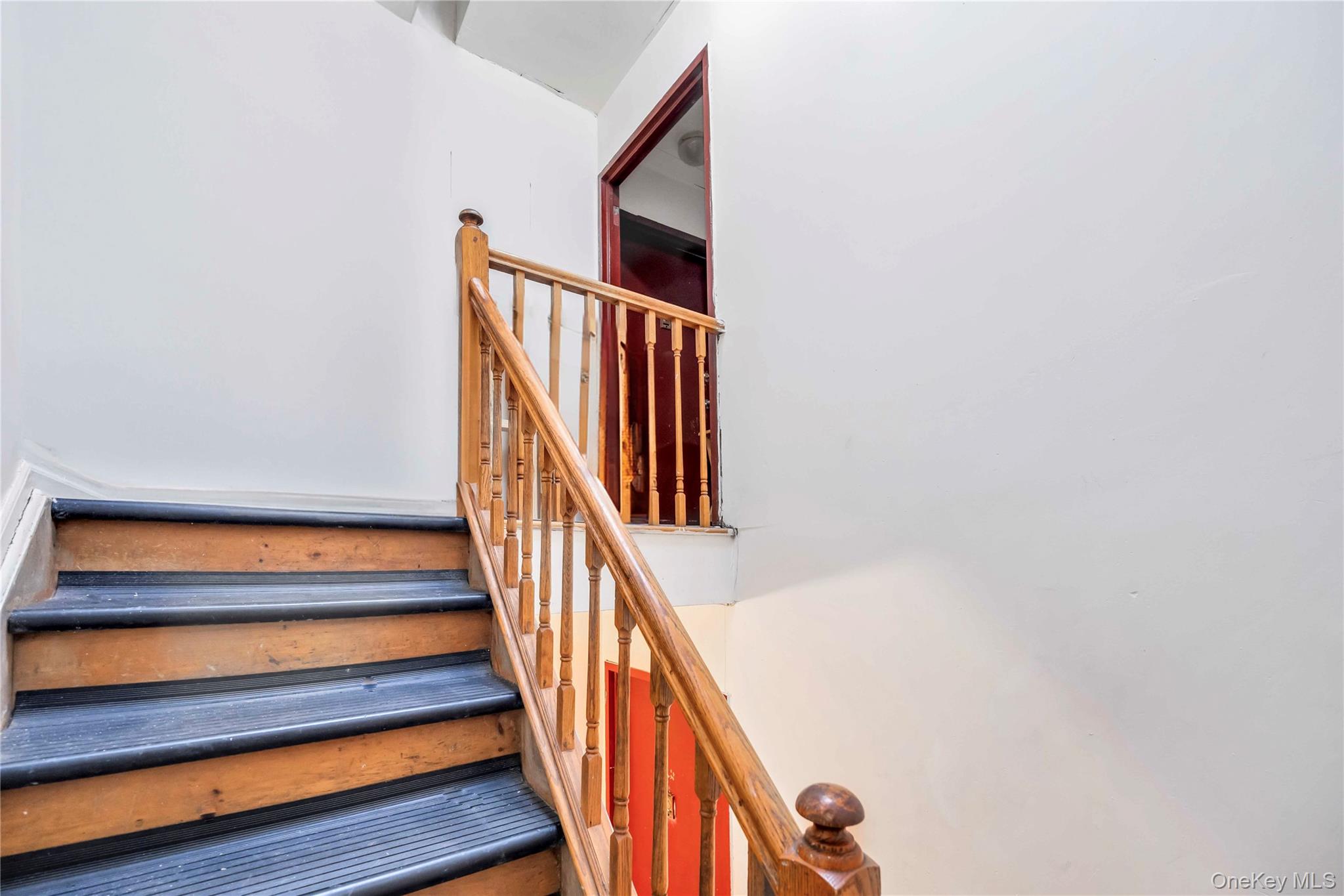 55-14 98th Street Queens, NY 11368 - Photo 37 of 49 a view of staircase with wooden floor and white walls