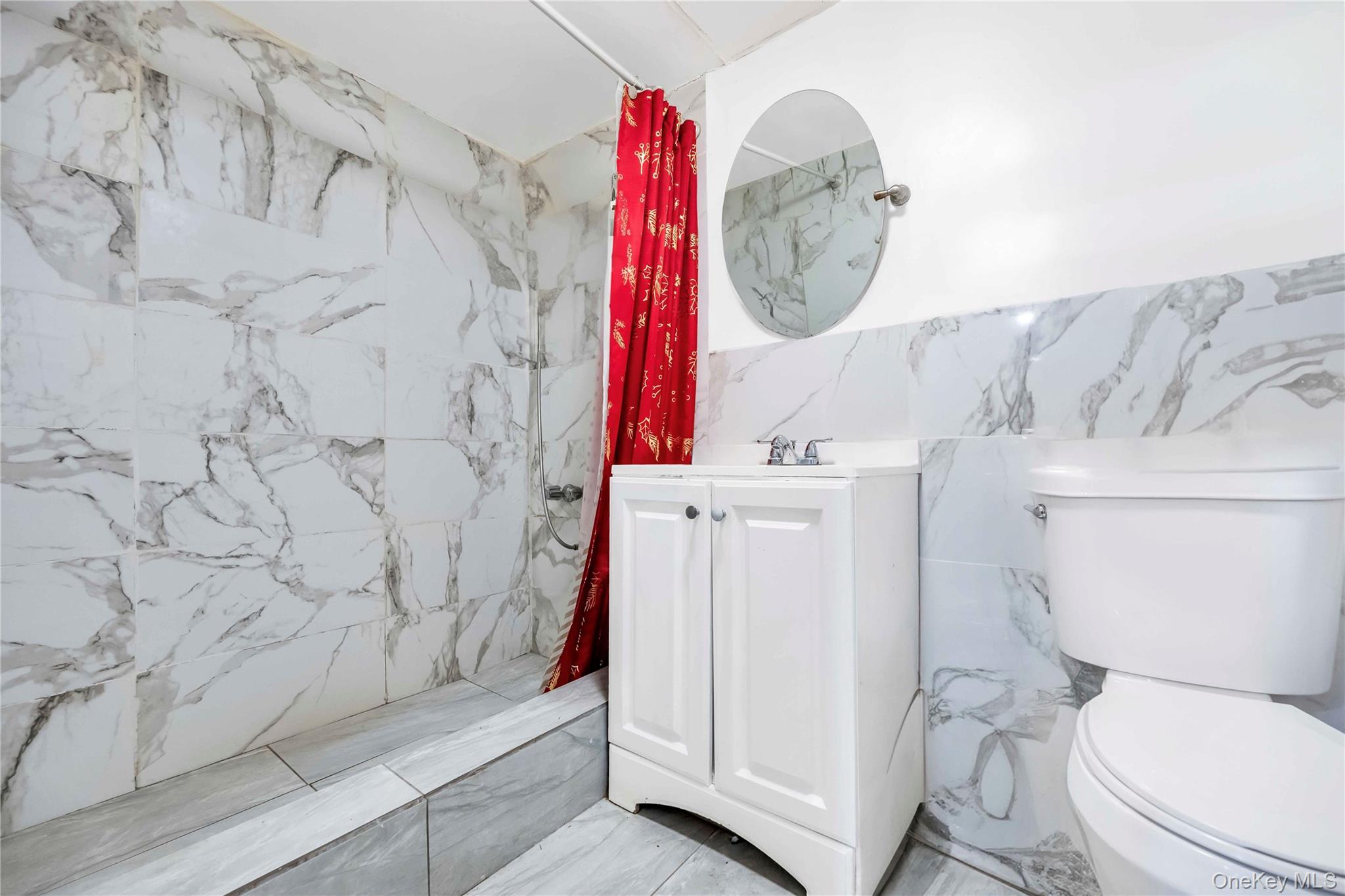 55-14 98th Street Queens, NY 11368 - Photo 4 of 49 a bathroom with a toilet and a shower