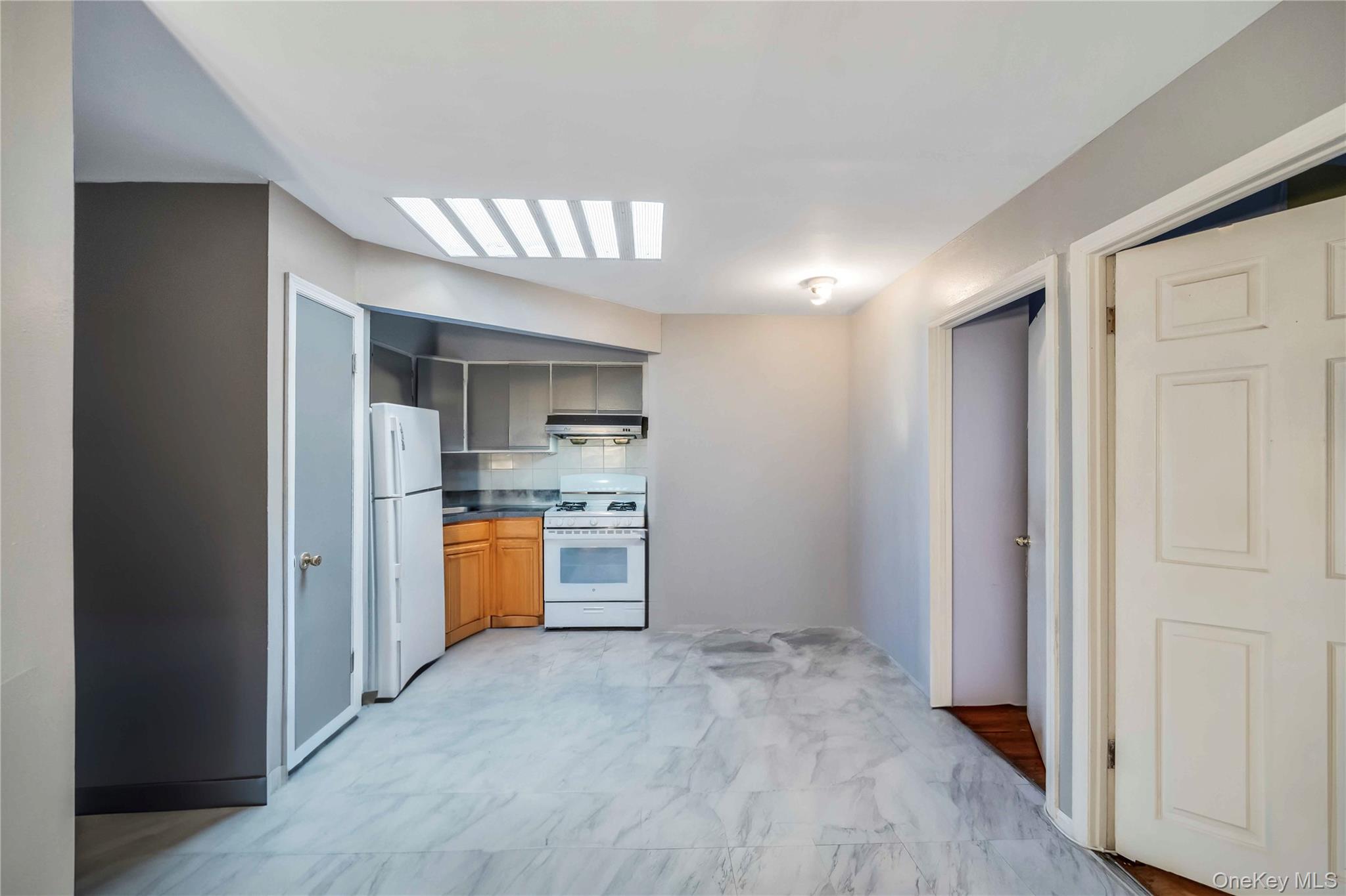 55-14 98th Street Queens, NY 11368 - Photo 42 of 49 a view of an empty room and kitchen