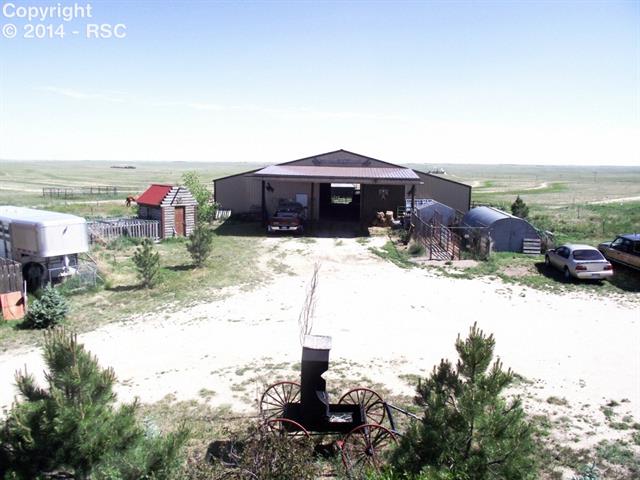 14475 Yoder Road Calhan, CO 80808 - Photo 4 of 7 This 60x70 haybarn is wood frame with metal siding and roof....it's built "country tough"! There is 220v in here too! As well as stalls and freeze proof waterers. Even space to park your big truck and store extra hay! HAY!
